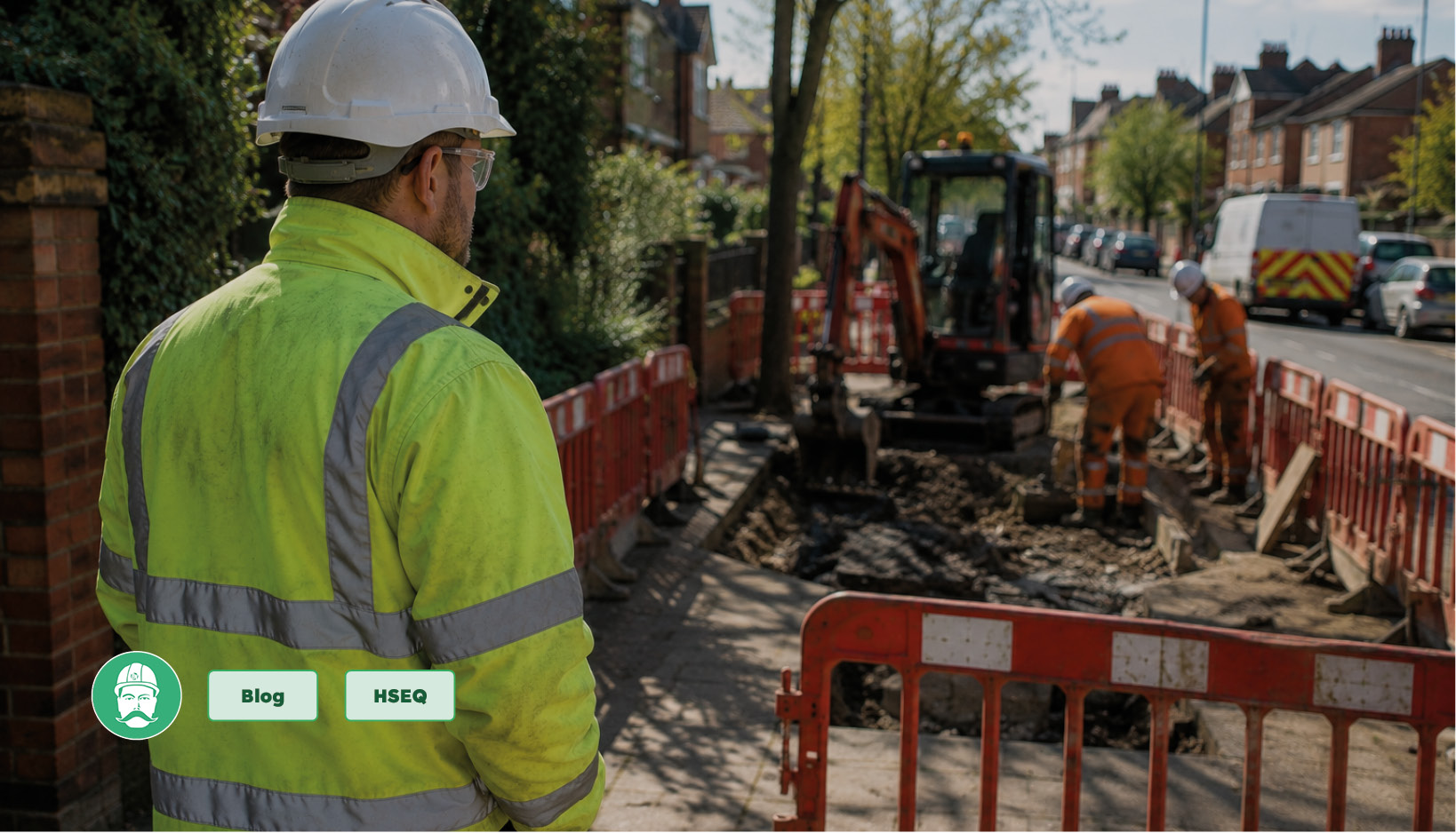 Site manager overseeing operatives carrying out utility works on a residential street.