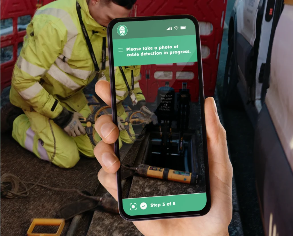 Field operative completing a work order using mobile job management software.